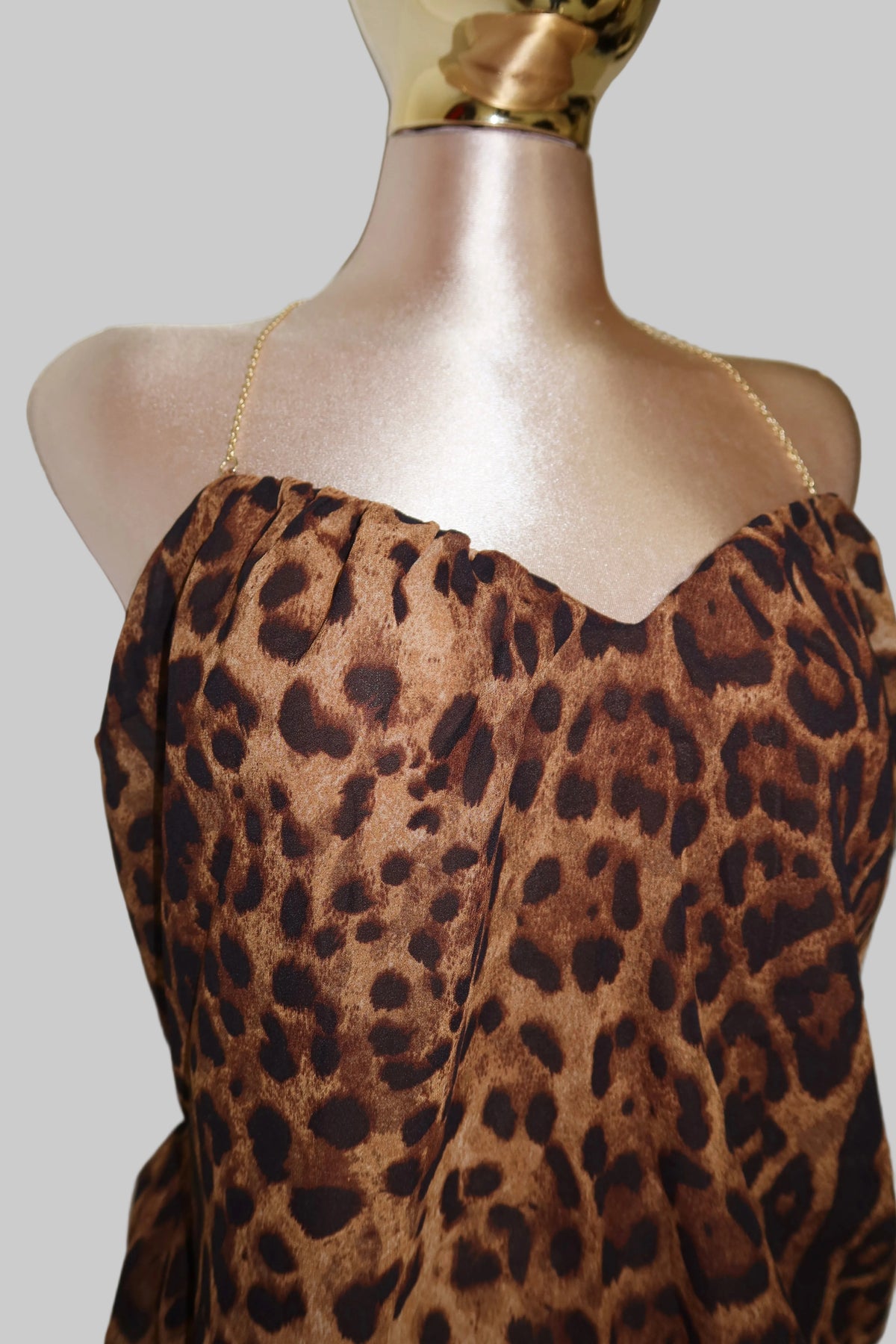 Brown and black leopard print strapless top.